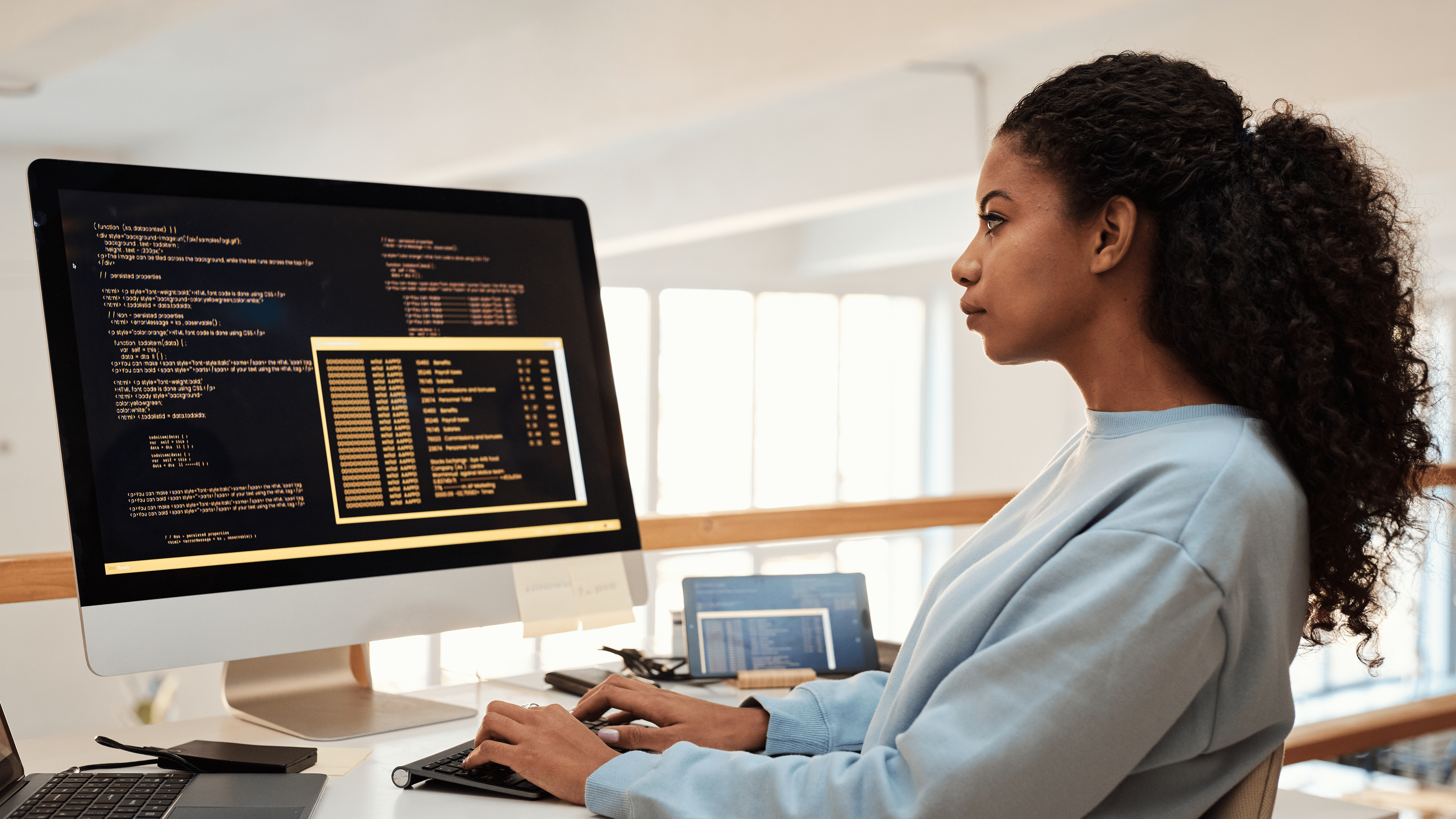 A DevOps engineer sitting down on a chair